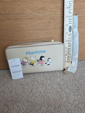 Coach Beige Peanuts Zip Around Wallet with Blue Logo